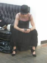 Dress, bowler hat, iPhone. Why not? Pic: D Wells